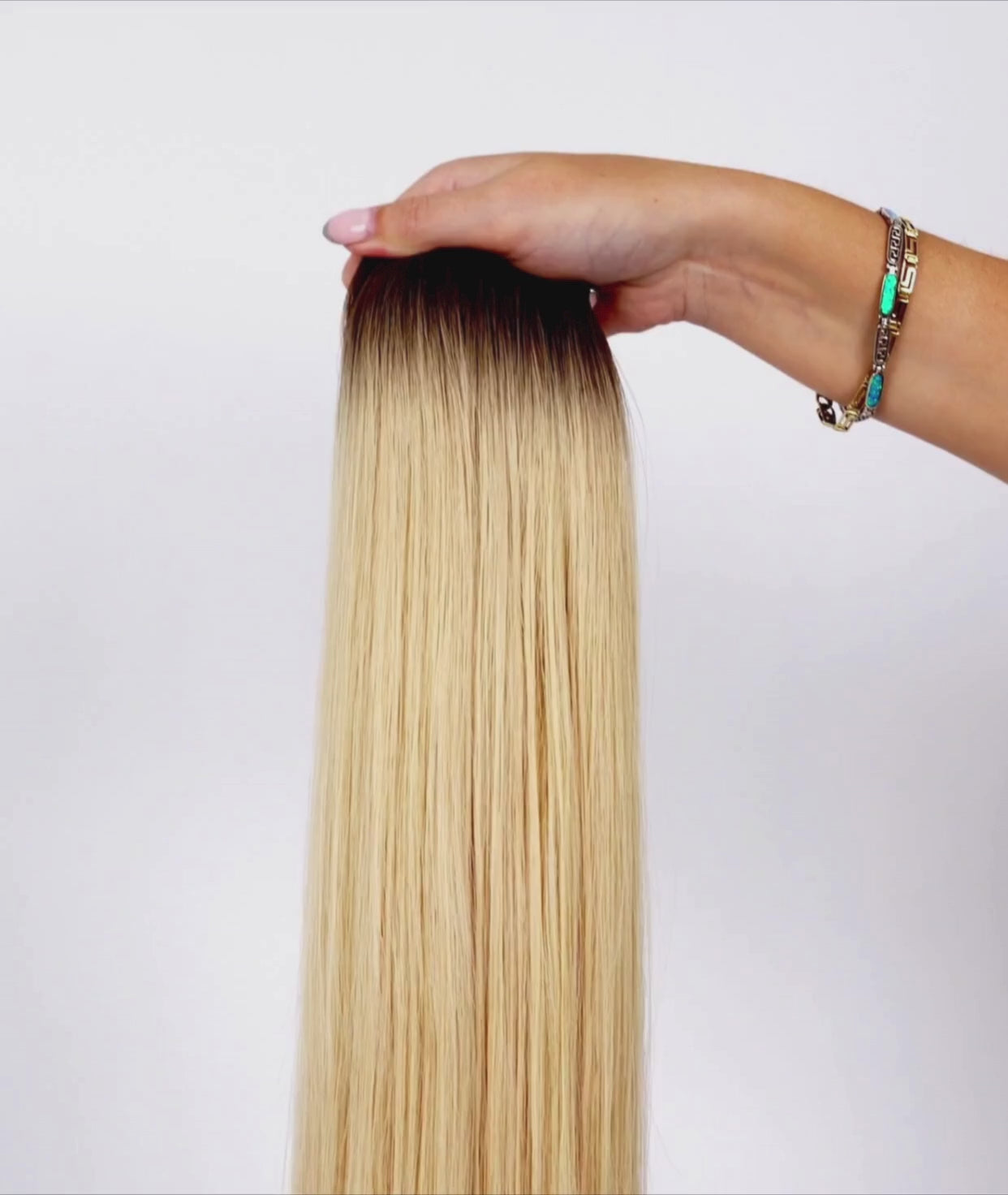 Load video: #Rooted Hollywood Blonde Ultra Seamless Tape In Hair Extensions (NEW)
