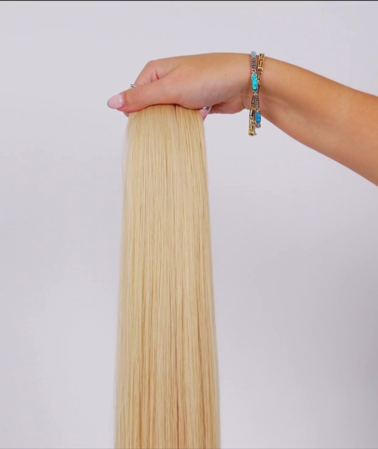 Load video: Hollywood Blonde Ultra Seamless Tape In Hair Extensions (NEW)