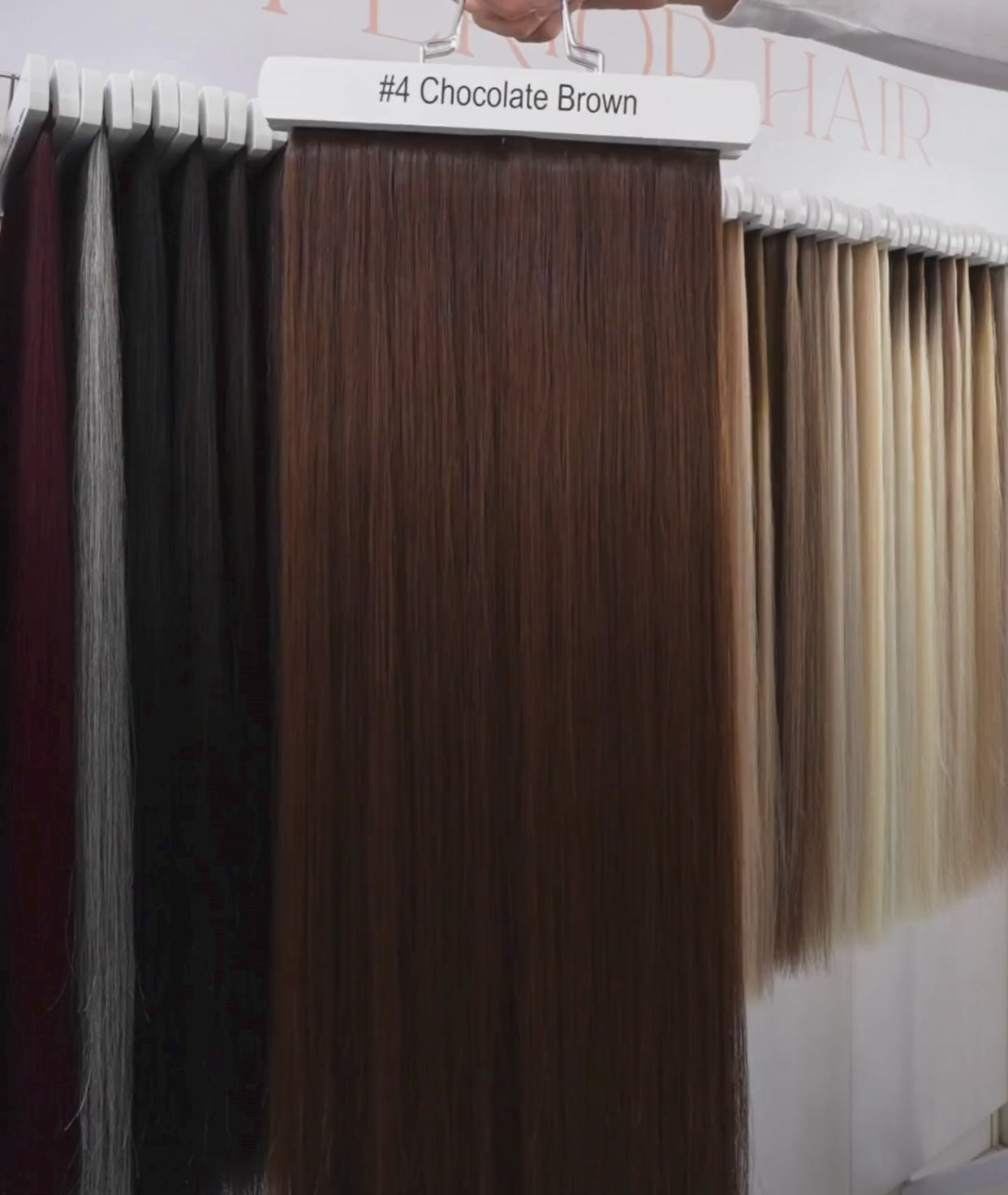 Load video: #4 Chocolate Brown Ultra Seamless Tape In Hair Extensions